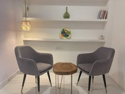 The consulting corner at Ekam, two chairs and a small table.